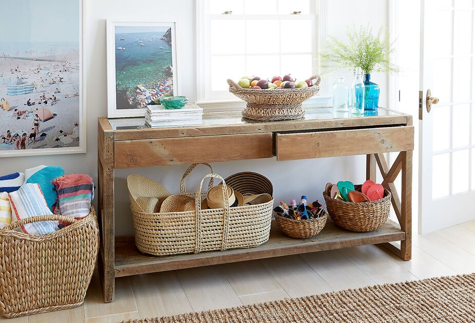 Woven baskets lend an entryway console table even more functionality and flair.
